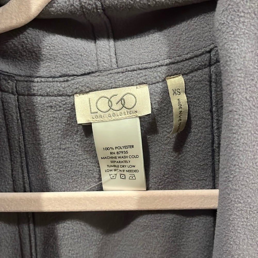 Logo sweater vest. Barely worn and in great condition.